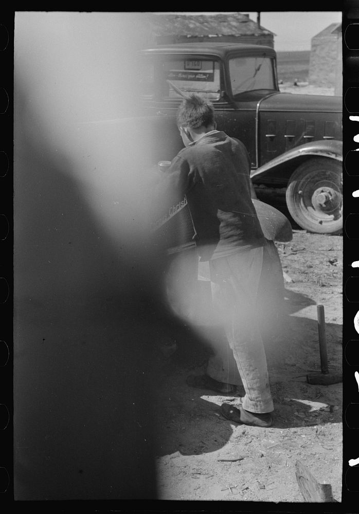 [Untitled photo, possibly related to: Son of migrant auto wrecker, Corpus Christi, Texas] by Russell Lee