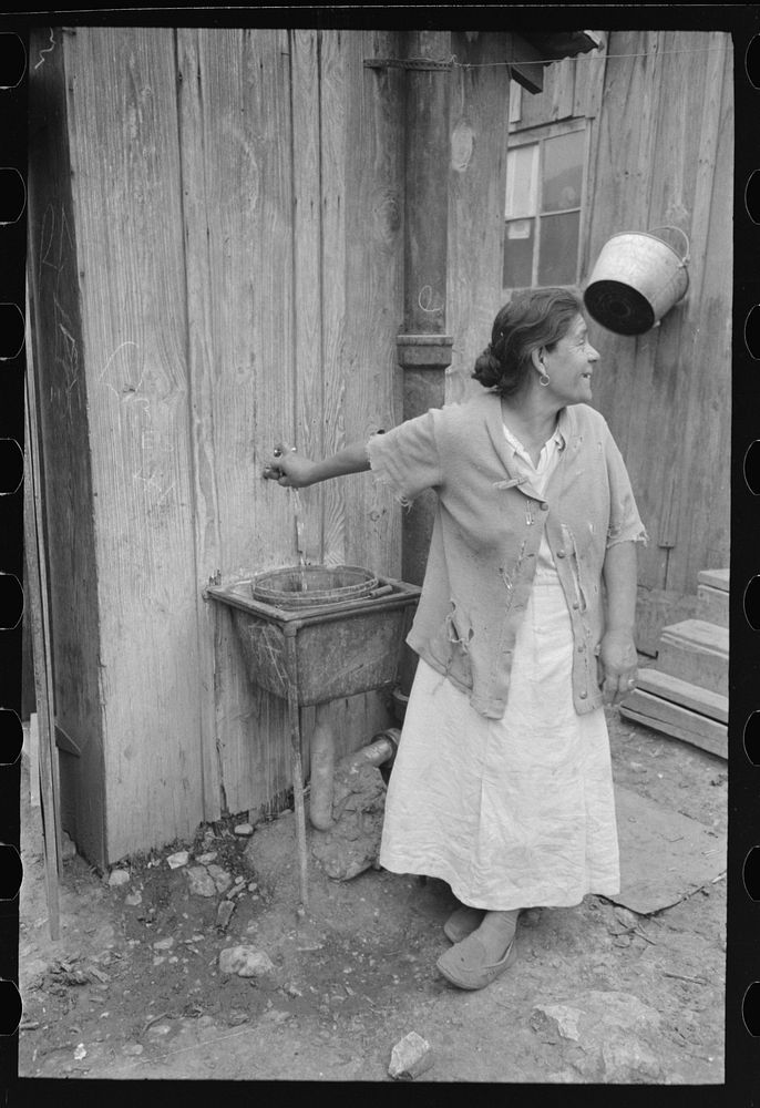 [Untitled photo, possibly related to: San Antonio. The Mexican section. Water supply of Mexican family living on the…