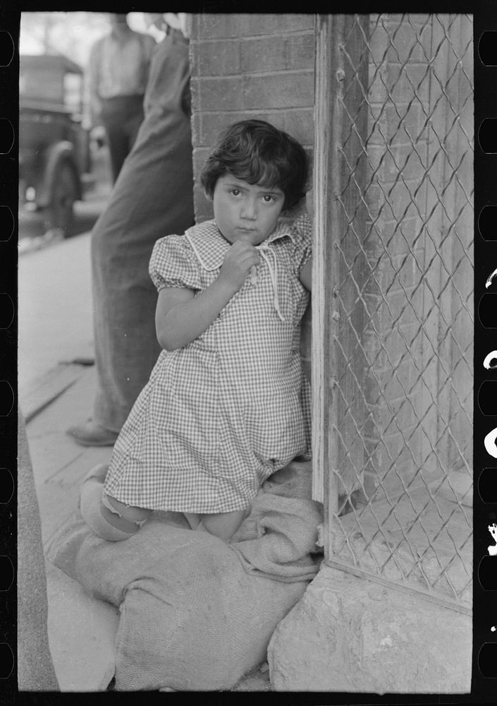 [Untitled photo, possibly related to: Young Mexican girl who was playing around relief line in San Antonio, Texas] by…