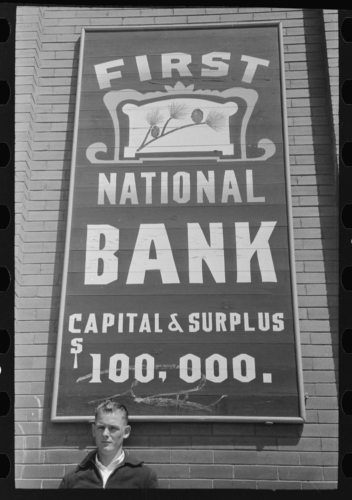 Sign and symbol of the First National Bank, San Augustine, Texas by Russell Lee