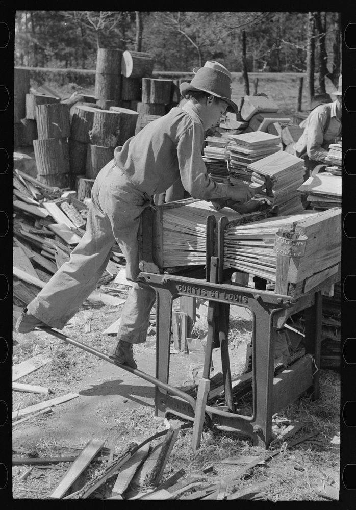 Young boy packing shingles at small mill near Jefferson, Texas by Russell Lee