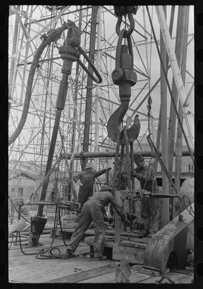 Activity at oil well showing one length of pipe resting on the kelly joint into the rat hole with operations for removing…