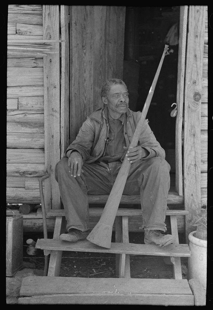 Old  (former slave) Willis Winn with horn with which slaves were called. Near Marshall, Texas by Russell Lee