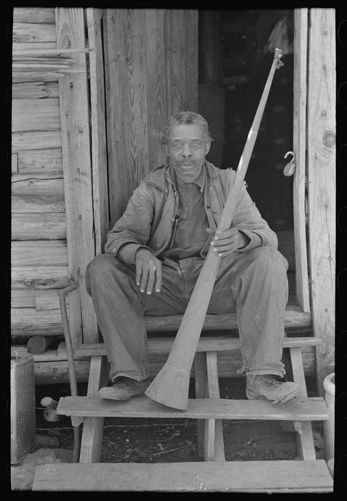 Old men, Willis Winn with horn. Near Marshall, Texas by Russell Lee