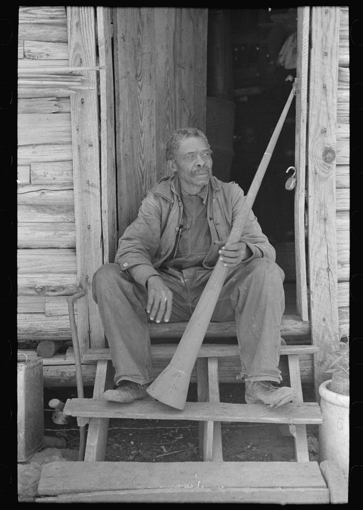 [Untitled photo, possibly related to: Old  (former slave) Willis Winn with horn with which slaves were called. Near…