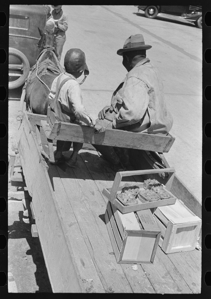  strawberry grower at loading stations, Hammond, Louisiana. Many growers in this section bring in a few crates of berries at…
