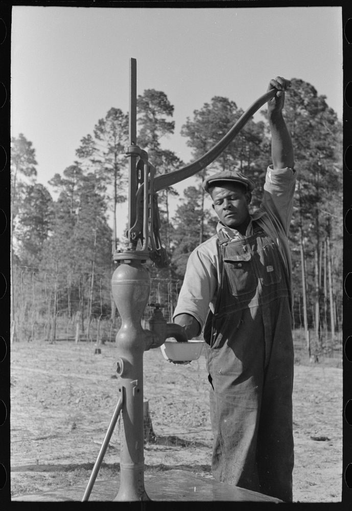 [Untitled photo, possibly related to: FSA (Farm Security Administration) client pumping water from his sanitary well, Sabine…