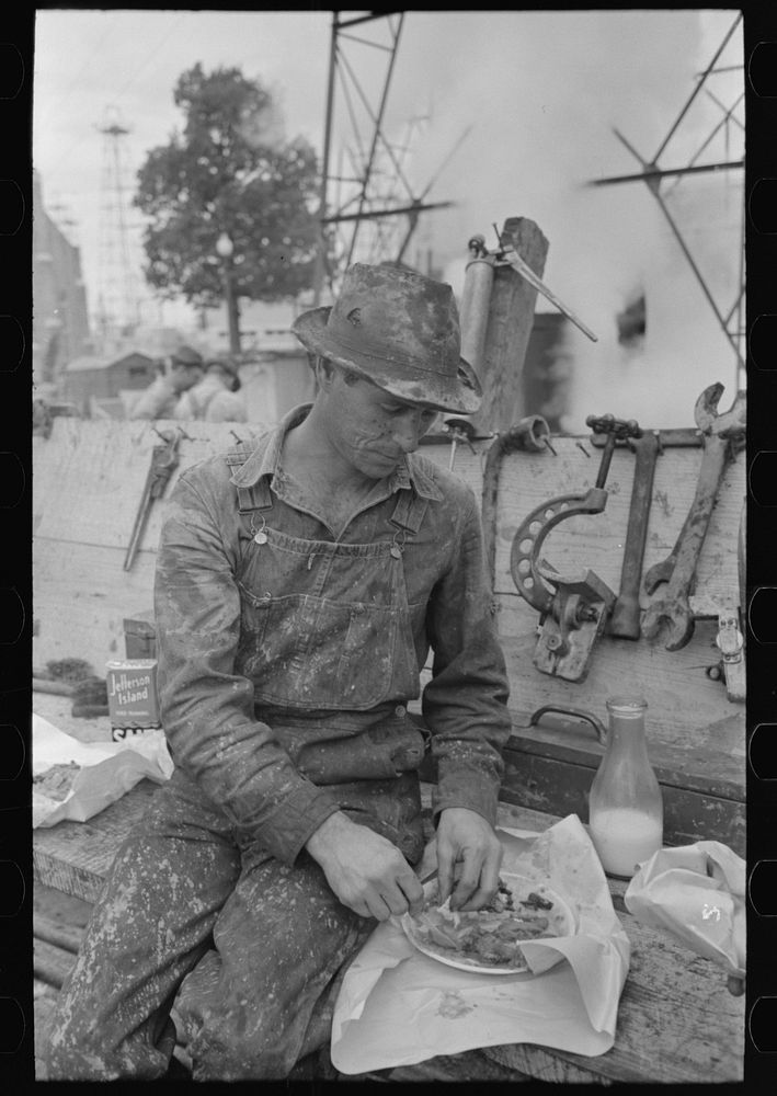 Oil field worker eating lunch, Kilgore, Texas by Russell Lee