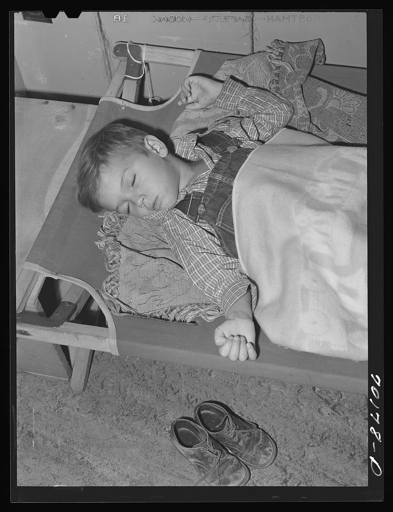 Child of farm worker takes a nap at the nursery school at the FSA (Farm Security Administration) farm family migratory labor…