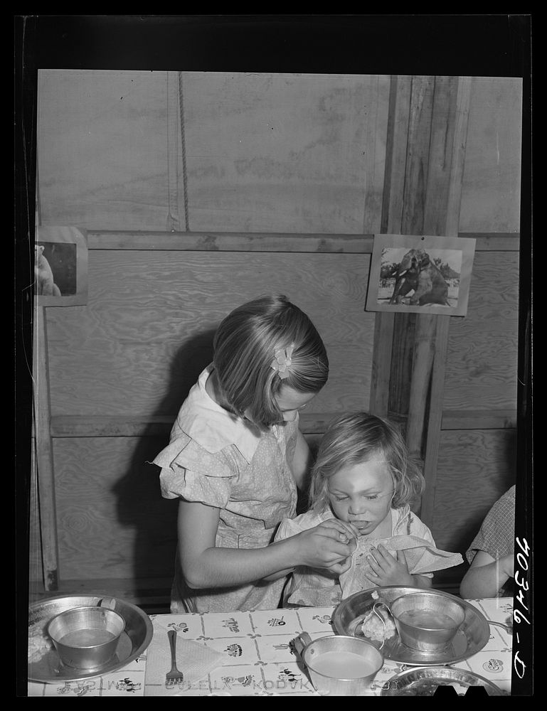 Lunch at the nursery school at the FSA (Farm Security Administration) mobile camp for migratory farm workers. Odell, Oregon.…