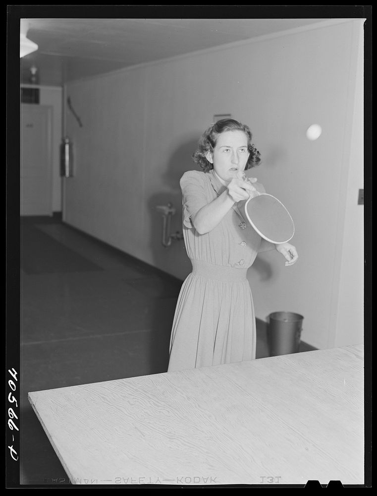 [Untitled photo, possibly related to: Woman that works at the Navy shipyards in the community room for women at the FSA…