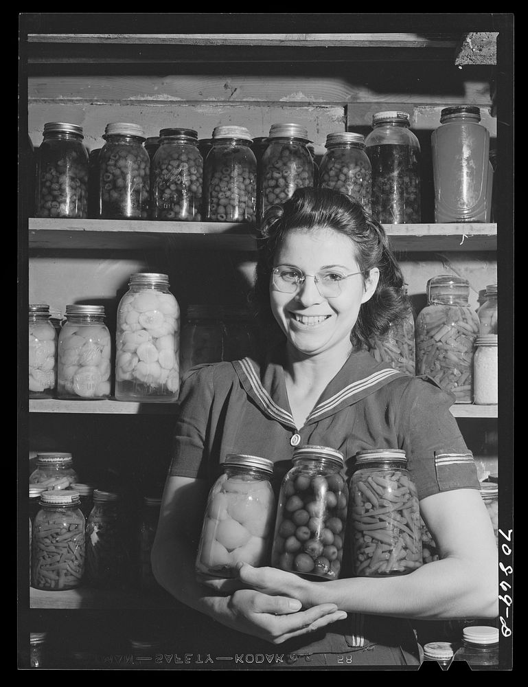 Mrs. Lee Wagoner with home canned fruits and vegetables. She and her husband farm on the Black Canyon Project. Canyon…