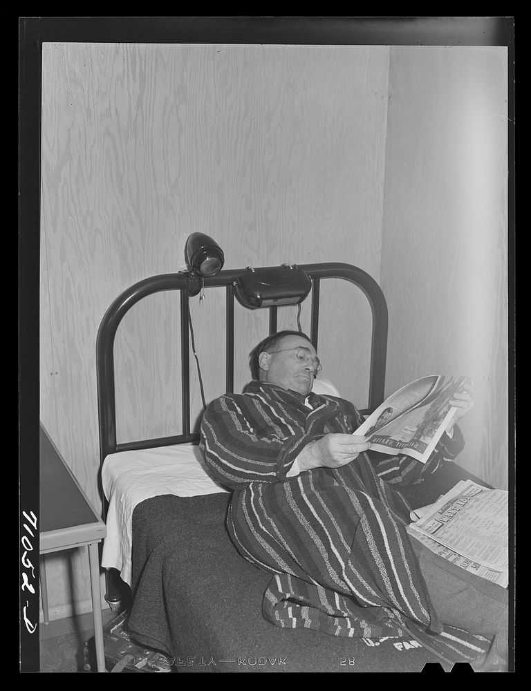[Untitled photo, possibly related to: Vallejo, California. Workman at Mare Island shipbuilding yards in his room at FSA…