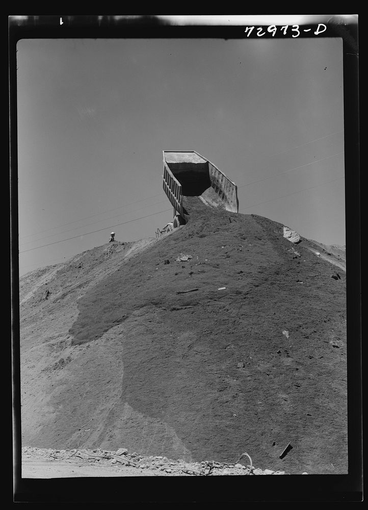 Shasta Dam, Shasta County, California. Dumping load of dirt which has been excavated at site of the dam by Russell Lee
