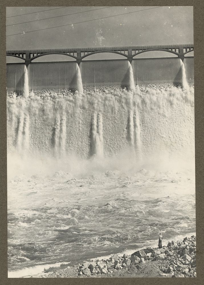 Grand Coulee Dam, Columbia Basin Reclamation Project, Wash. A portion of the spillway. A man standing in the lower right…