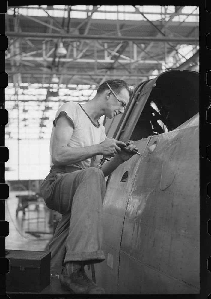 Nashville, Tennessee. Vultee Aircraft Company. Riveting a fuselage on a sub-assembly line. Sourced from the Library of…