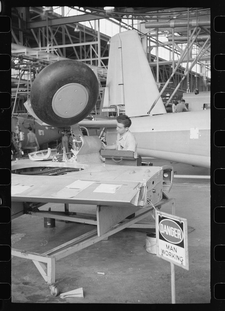 Nashville, Tennessee. Vultee Aircraft Compnay. Working on the landing gear of a bomber. Sourced from the Library of Congress.