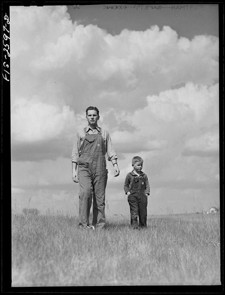 Youngest brother, Tom, takes Gene on a tour of the farm. Near Ames, Iowa. Sourced from the Library of Congress.