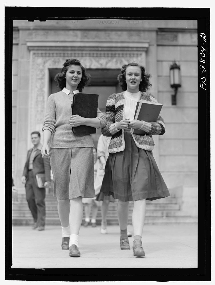 Students coming out of the library at Iowa State College. Ames, Iowa. Sourced from the Library of Congress.