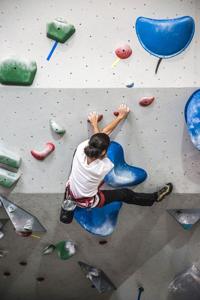 Free person climbing indoor rock wall photo, public domain sport CC0 image.