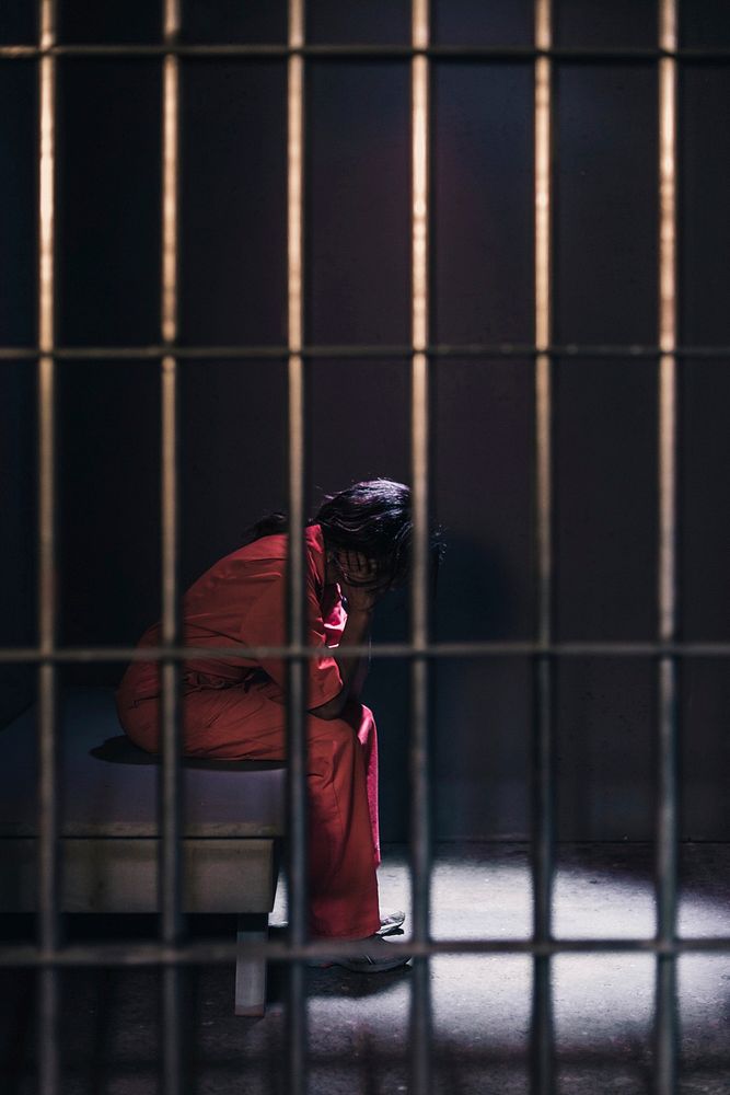 Free woman in prison image, public domain people CC0 photo.
