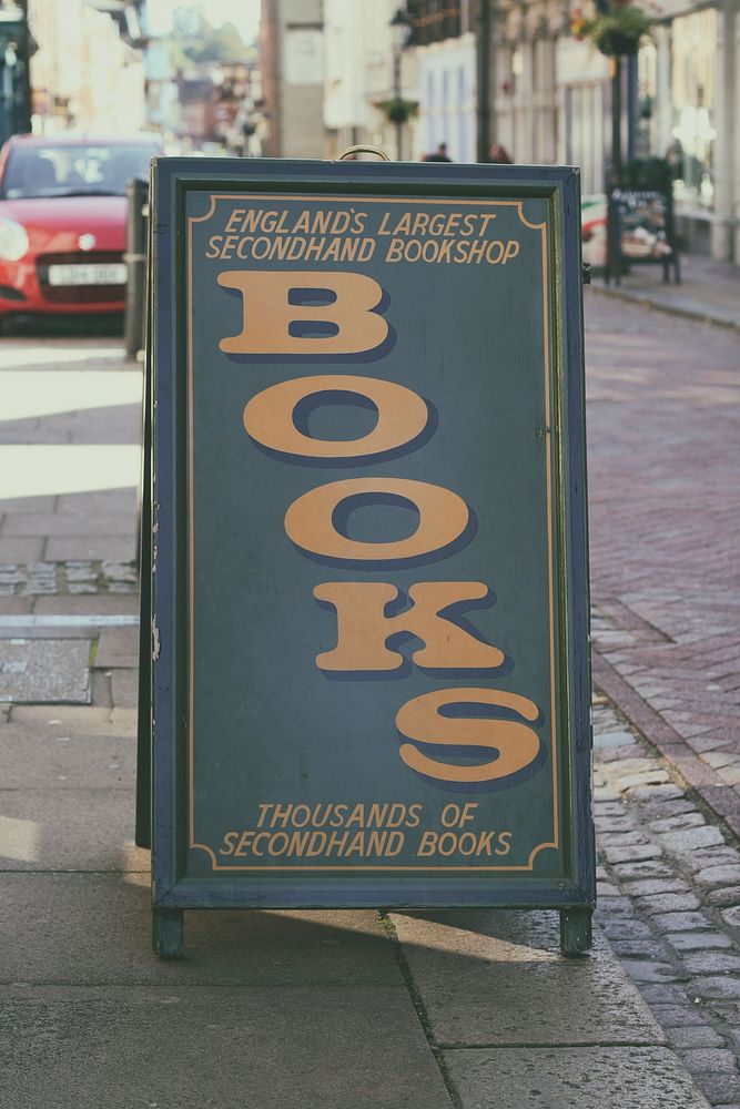 Free book shop sidewalk sign photo, public domain CC0 image.