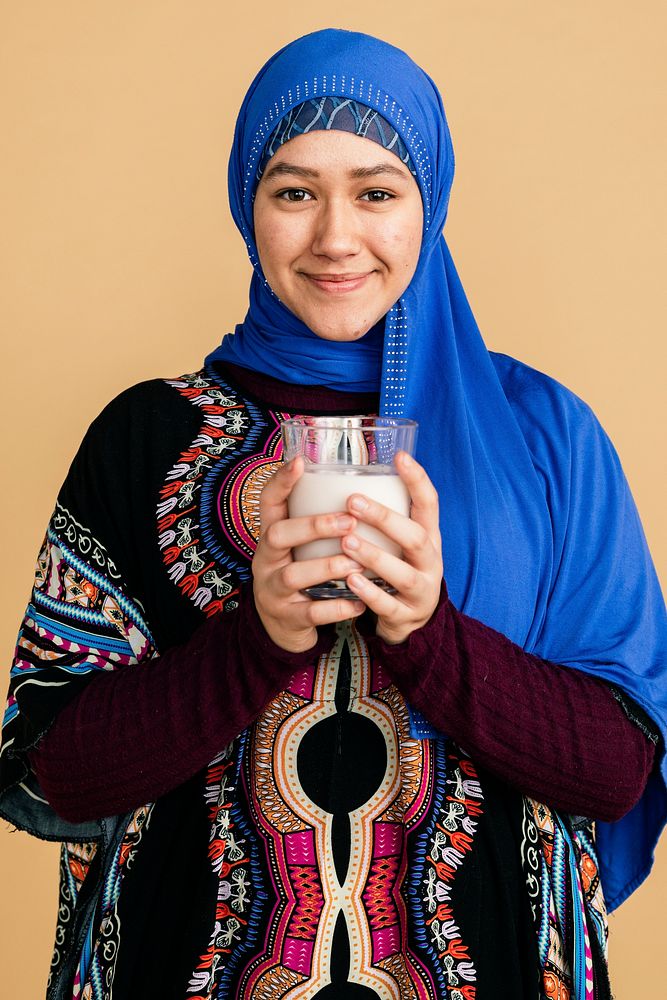 Muslim woman with a glass of soy milk
