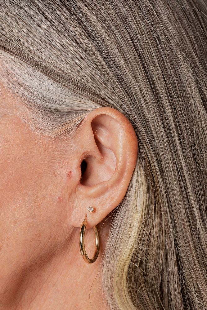 Senior woman wearing hoop earrings 
