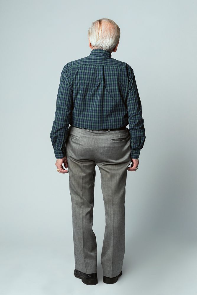 Rear view of a senior man in a tartan scott shirt