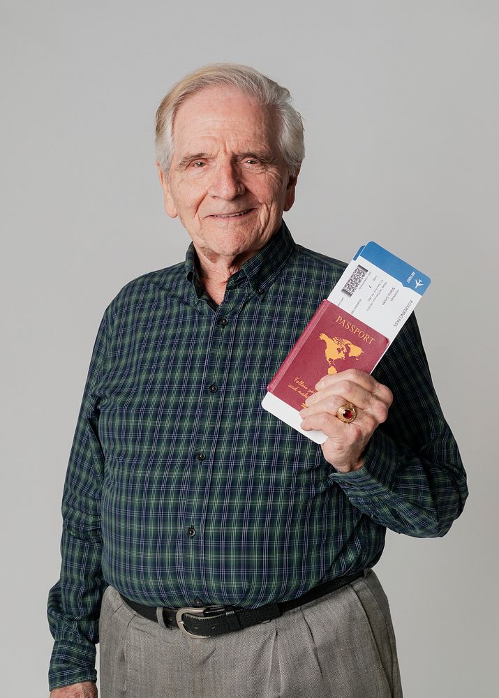 Senior man traveling with his passport 