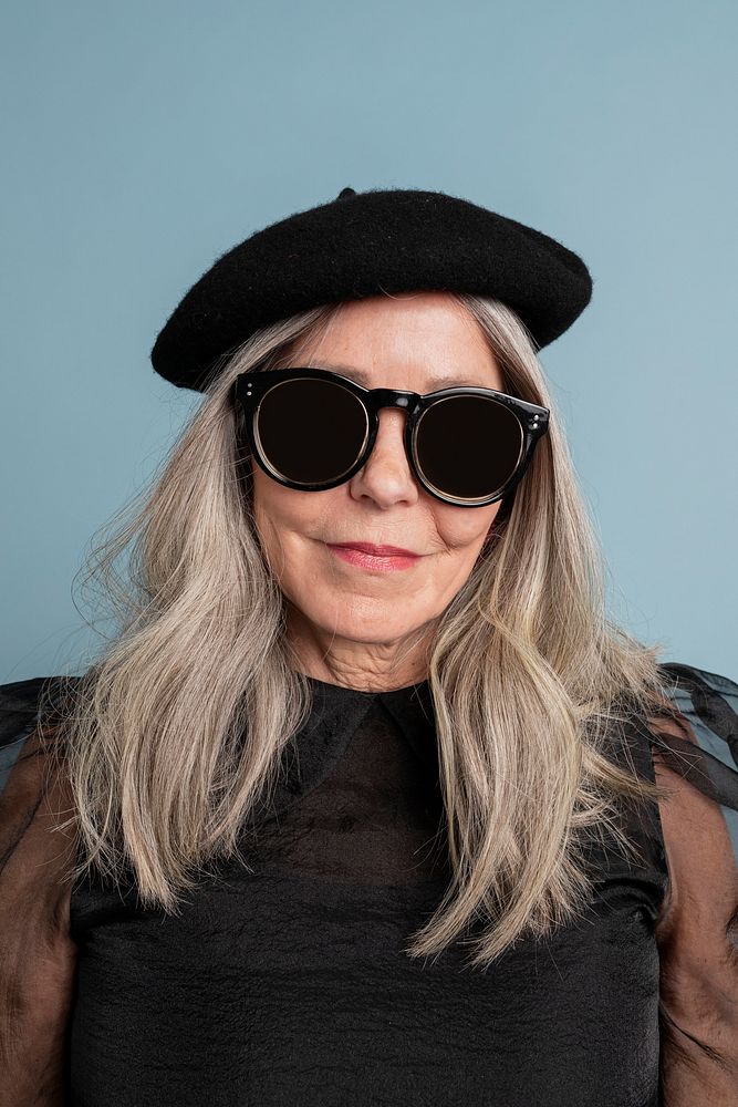 Cool grandma with an attitude in a beret and sunglasses