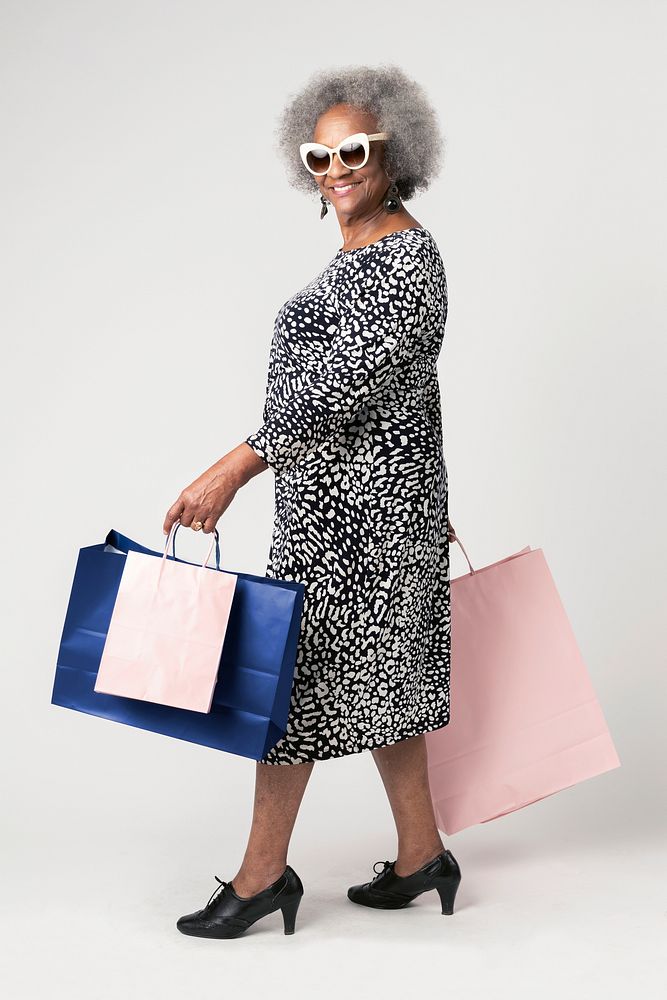 Happy senior woman on a shopping spree