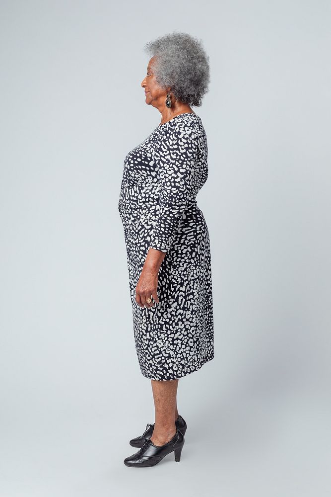 Stylish black senior woman with afro hair in a profile shot 
