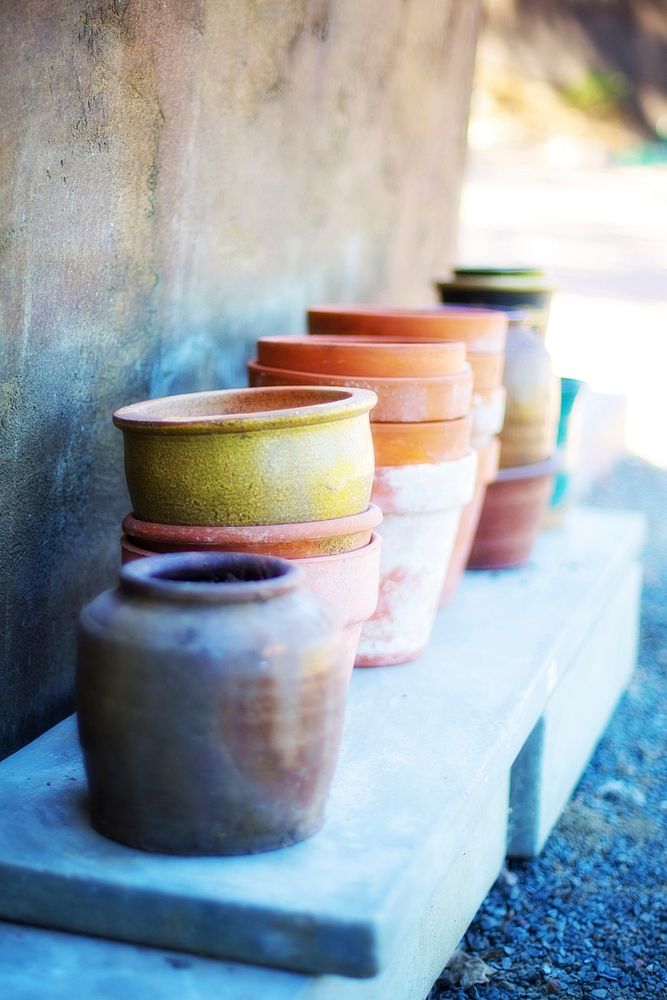 Old pots in garden, free public domain CC0 image.