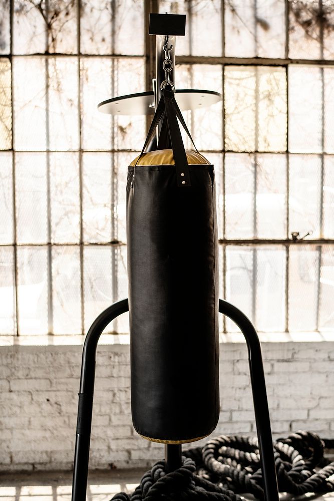 Punching bag hanging by the window