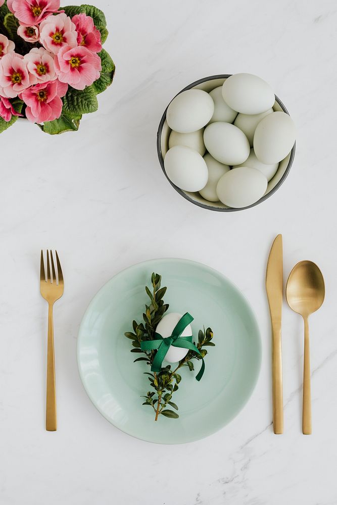 Aerial view of raw eggs on a white marble table