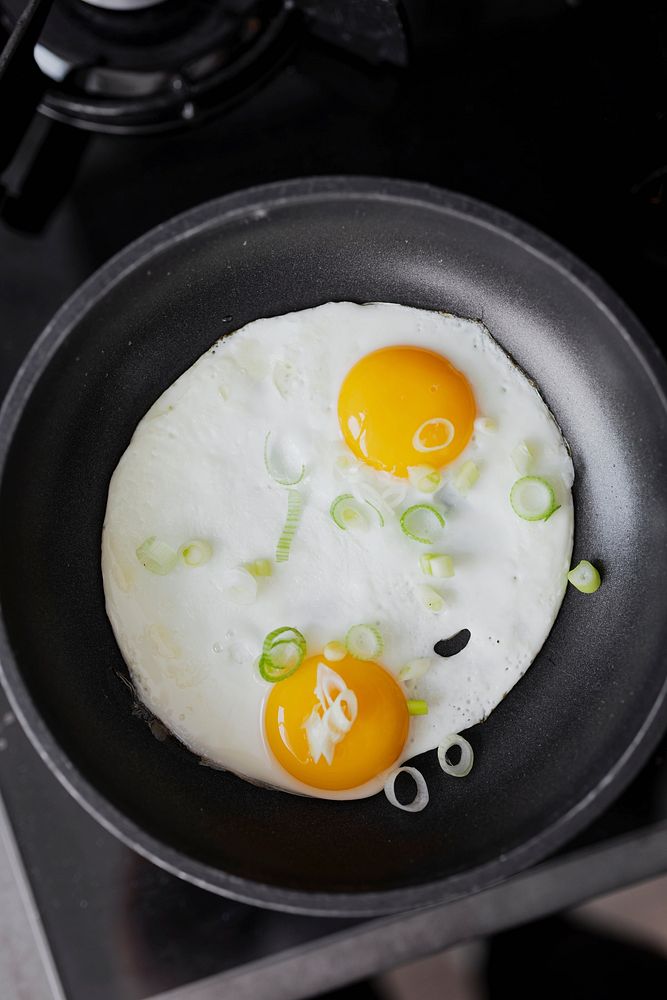 Sunny side up fried eggs in a cooking pan