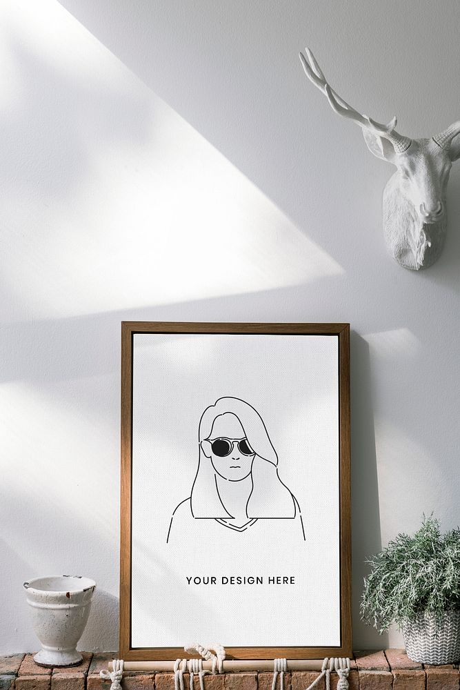 Wooden frame mockup against a white wall