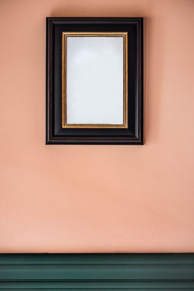 Black frame against a peach wall