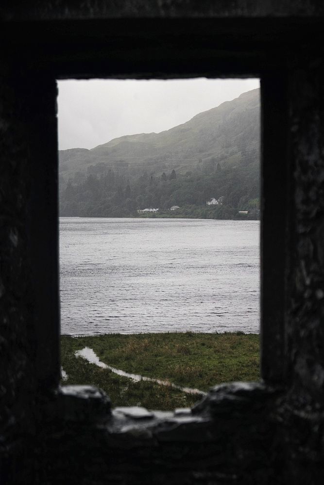Sea view through a rocky window of Kilchurn Castle, Scotland