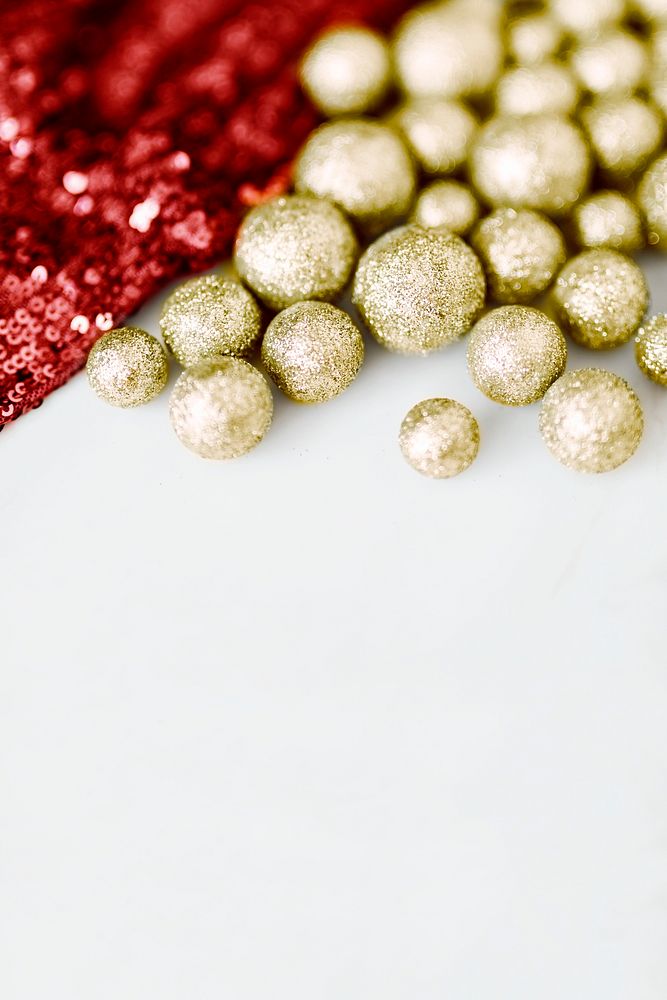 Glitter gold baubles and red sequin textile