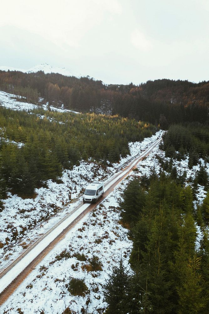 Drone shot of a snowy road in the Trossachs, Scotland