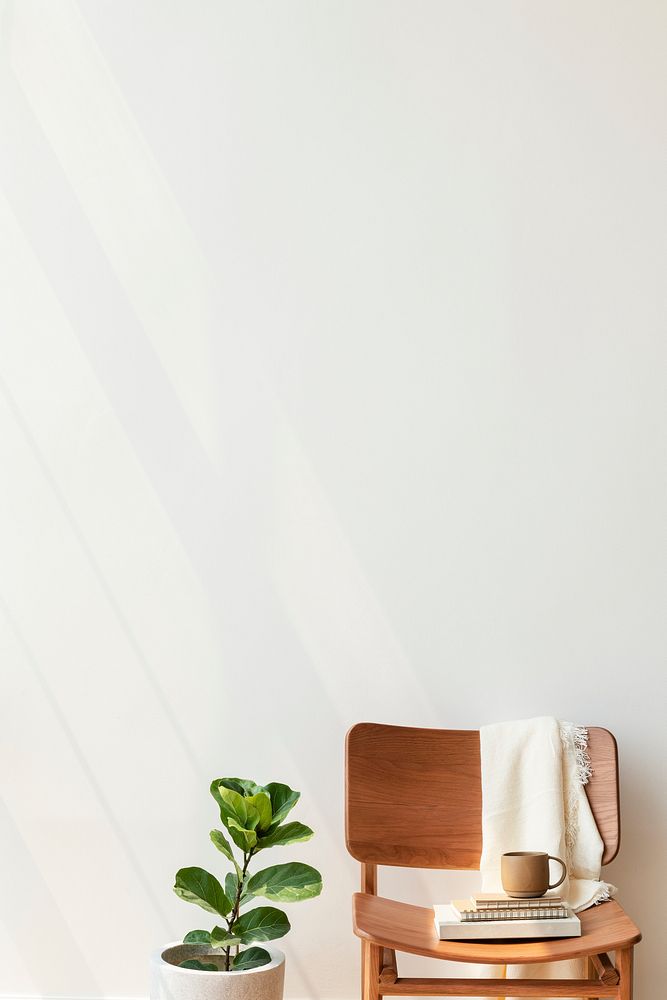 Classic wooden chair by a fiddle-leaf fig plant