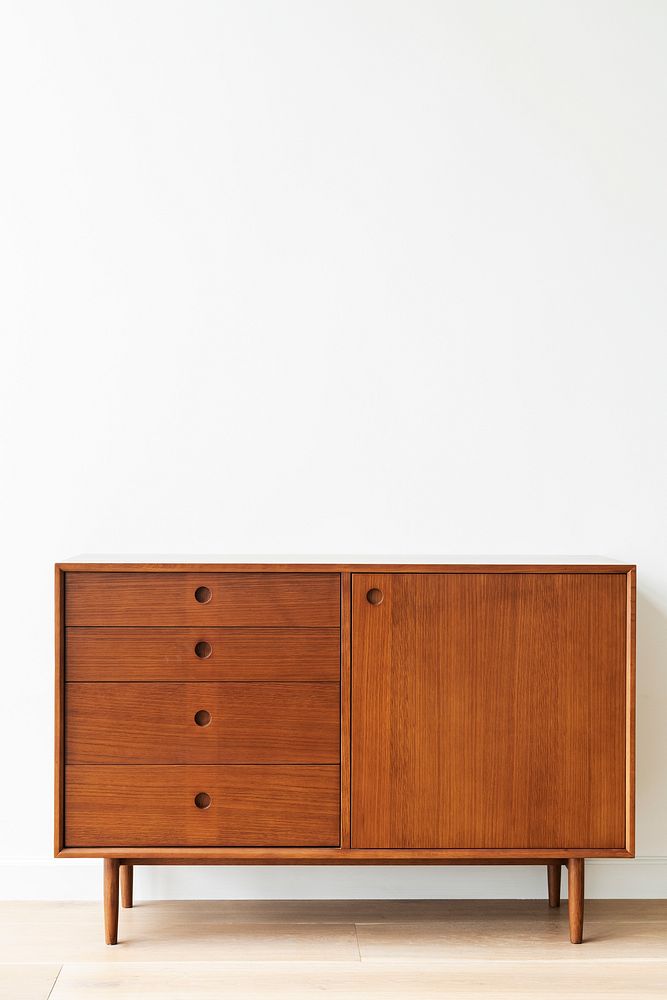 Mid century modern wood cabinet by a white wall