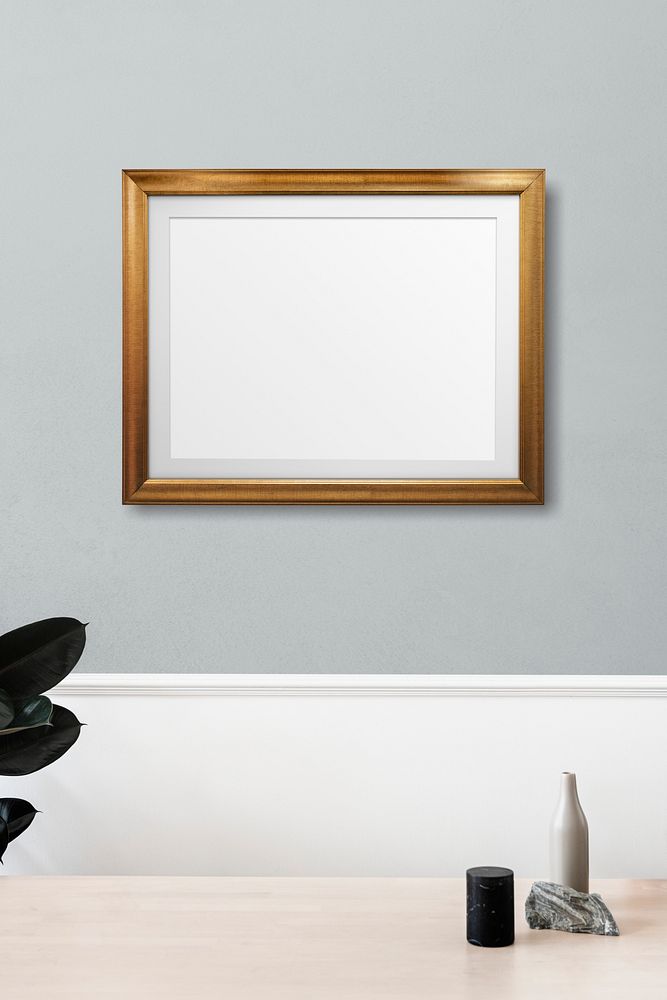 Picture frame hanging on a gray wall 
