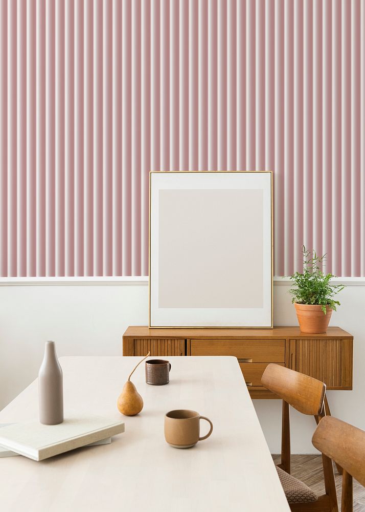 Blank frame on a wooden sideboard against the wall