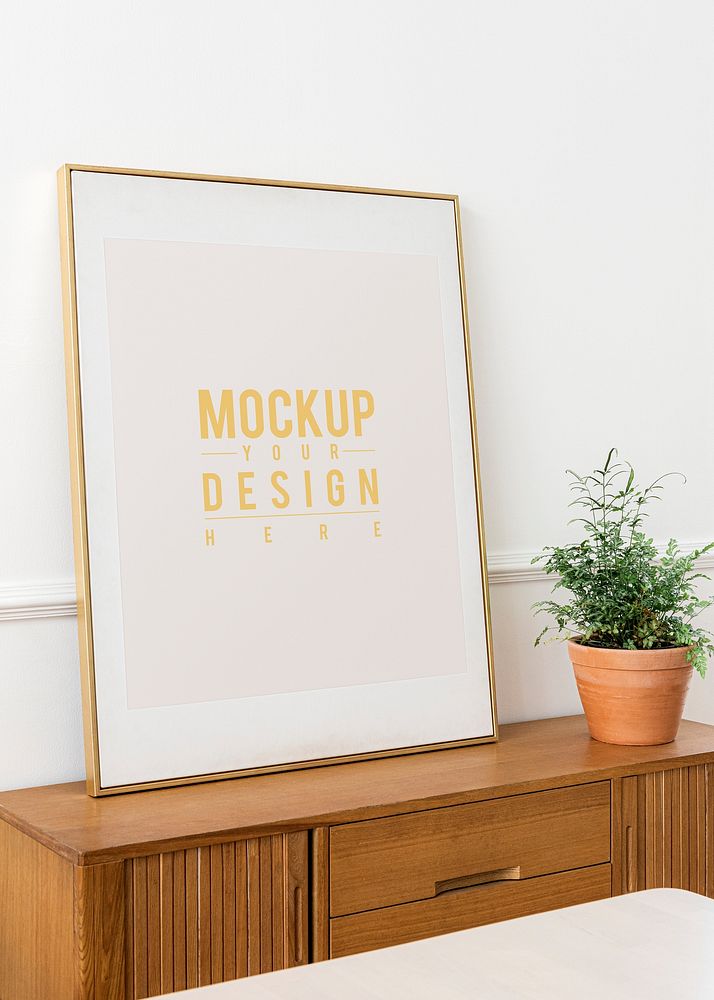 Picture frame mockup on a wooden cabinet