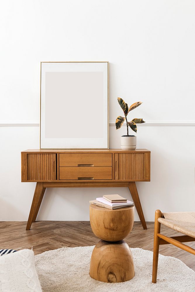 Picture frame on a wooden sideboard table