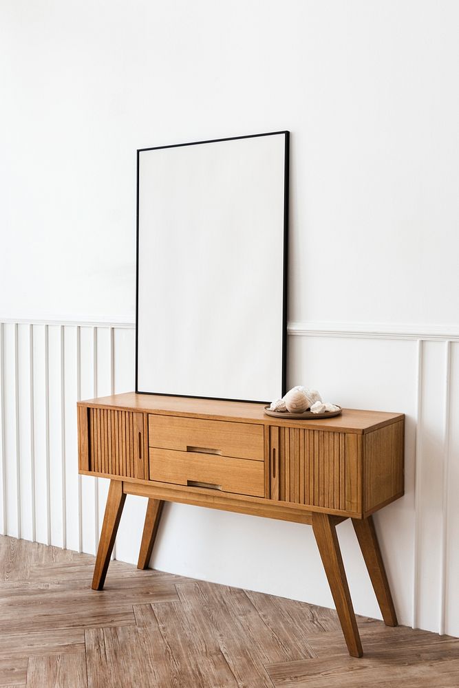 Picture frame on a wooden sideboard table