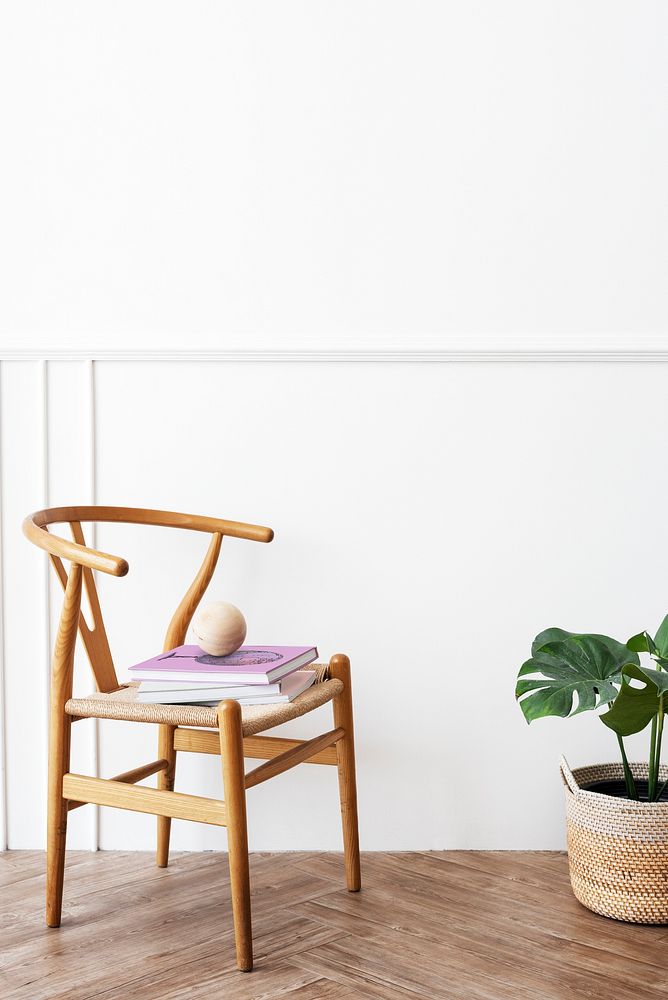 Classic wooden chair by a monstera plant